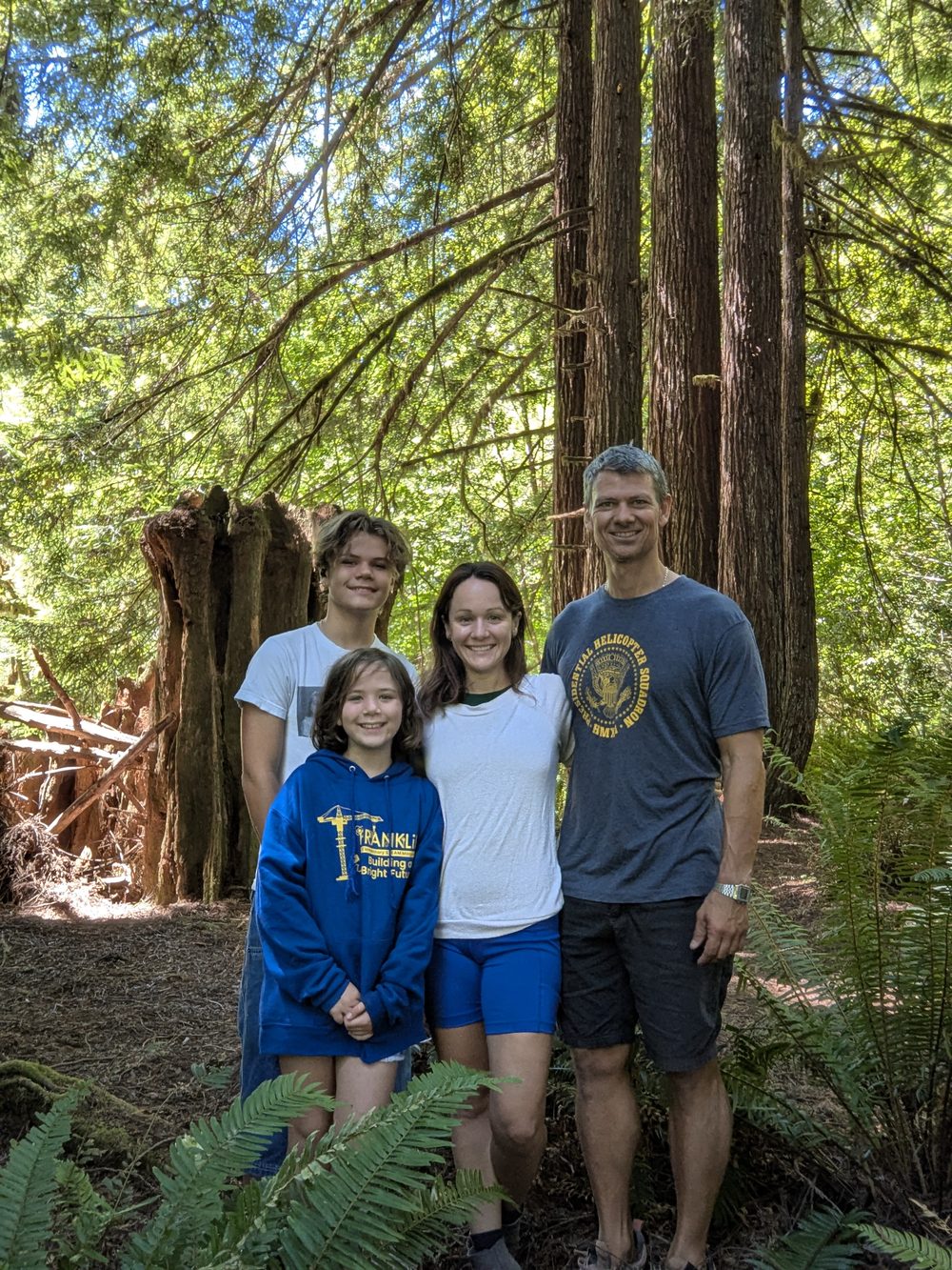 Curtis Carll and his family among the redwoods at Del Norte Coast Redwoods State Park