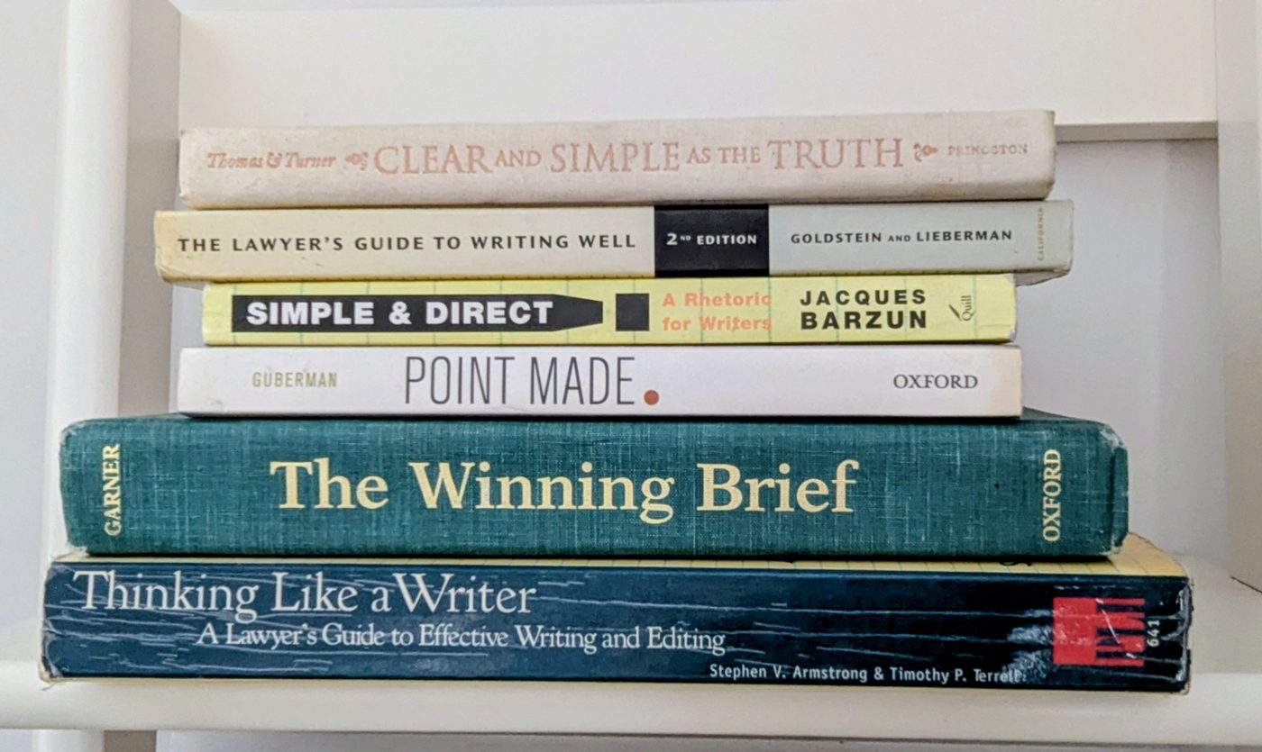 A stack of writing and legal-rhetoric books from Curtis Carll's office